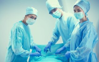 Team surgeon at work in operating room