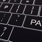 A computer keyboard demanding money via a paywall