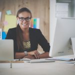 A woman working at her office computer