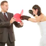 Bride boxing her groom on wedding day