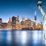 The Statue of Liberty with Lower Manhattan background in the evening, Landmarks of New York City