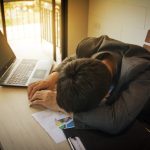 stressed business man on wood table