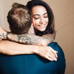 Beautiful, young couple hugging indoors