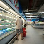 Supermarket blurred background with colorful shelves