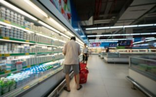 Supermarket blurred background with colorful shelves