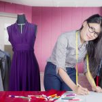 Female designer draws sketch in the office
