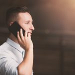 A man talking on the phone instead of texting, which may seem polite but isn't