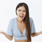 A woman who is upset and making a complaint