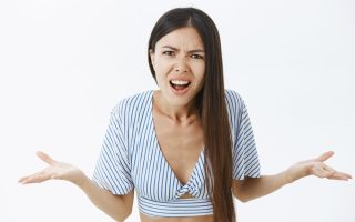 A woman who is upset and making a complaint