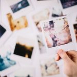 Someone holding a photo, something that can capture memories that people regret not saving