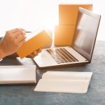 Someone selling items online, which is a hidden income stream that you can start without quitting your job