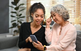 A grandmother with her daughter doing one of the things that grandparents do that offend modern parents