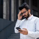 A man distraught about his text messages not receiving a response