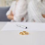 A couple getting divorced with their rings on a table