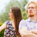 A couple feeling strong emotions and being at arm's length from each other