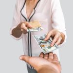 A woman lending money to family