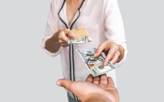 A woman lending money to family