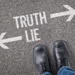 Truth/Lie written on concrete