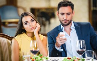 A man not interested in his date, because he will probably ghost her.