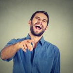 A man mocking someone, who may be a family member lacking respect