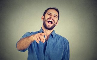 A man mocking someone, who may be a family member lacking respect