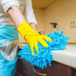 Someone cleaning their home with habits that only make things dirtier