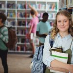 A young female student in a school library