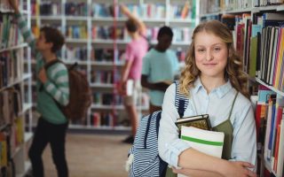A young female student in a school library