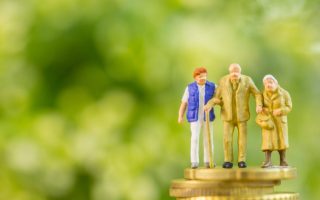 Model family on a stack of coins, symbolizing generational wealth