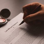 Someone signing a last will and testament