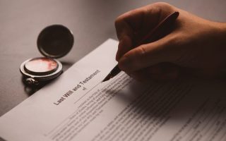 Someone signing a last will and testament