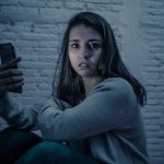 A woman suffering from mental health problems because of social media