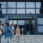 A group of students going into one of the many schools that teach inaccurate facts.