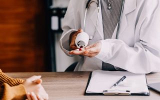 A doctor giving medication to a patient