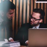 A man giving career advice to a co-worker