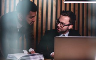 A man giving career advice to a co-worker