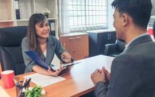 A man sitting down for a job interview