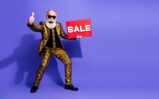 An excited older man loyal to a company because of a corporate strategy