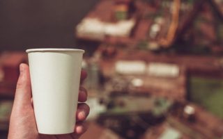 A hot coffee cup that needs a warning