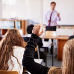A group of students in a public school classroom
