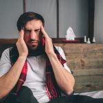 A man suffering from side effects from taking medicine