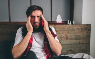 A man suffering from side effects from taking medicine