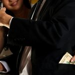 There are some body language signs that say she's studying your wallet, not your face.