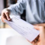 Some employers delay paychecks to trap workers.